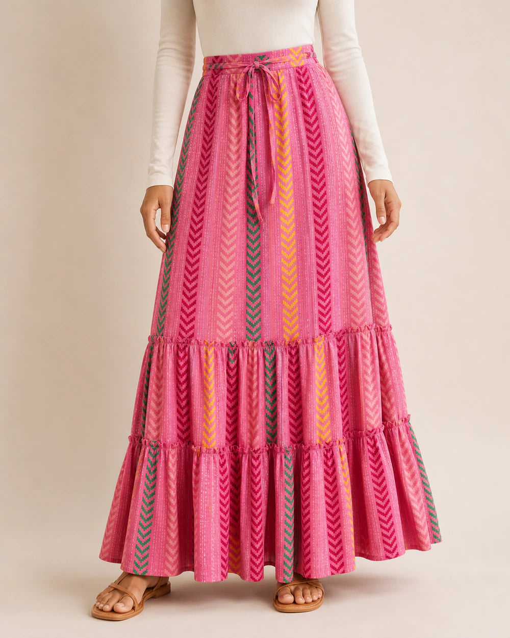 Women’s Pink printed tiered maxi skirt, front product view.
