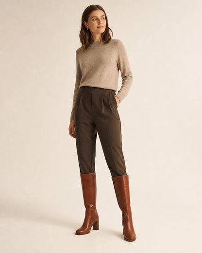 Women's cognac-brown knee-high boots with tailored styling.