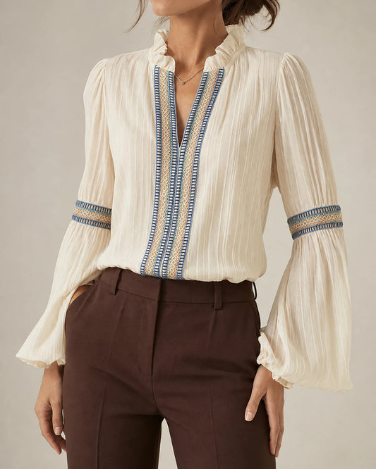 Women's ivory vintage blouse with embroidered trim, front product view.