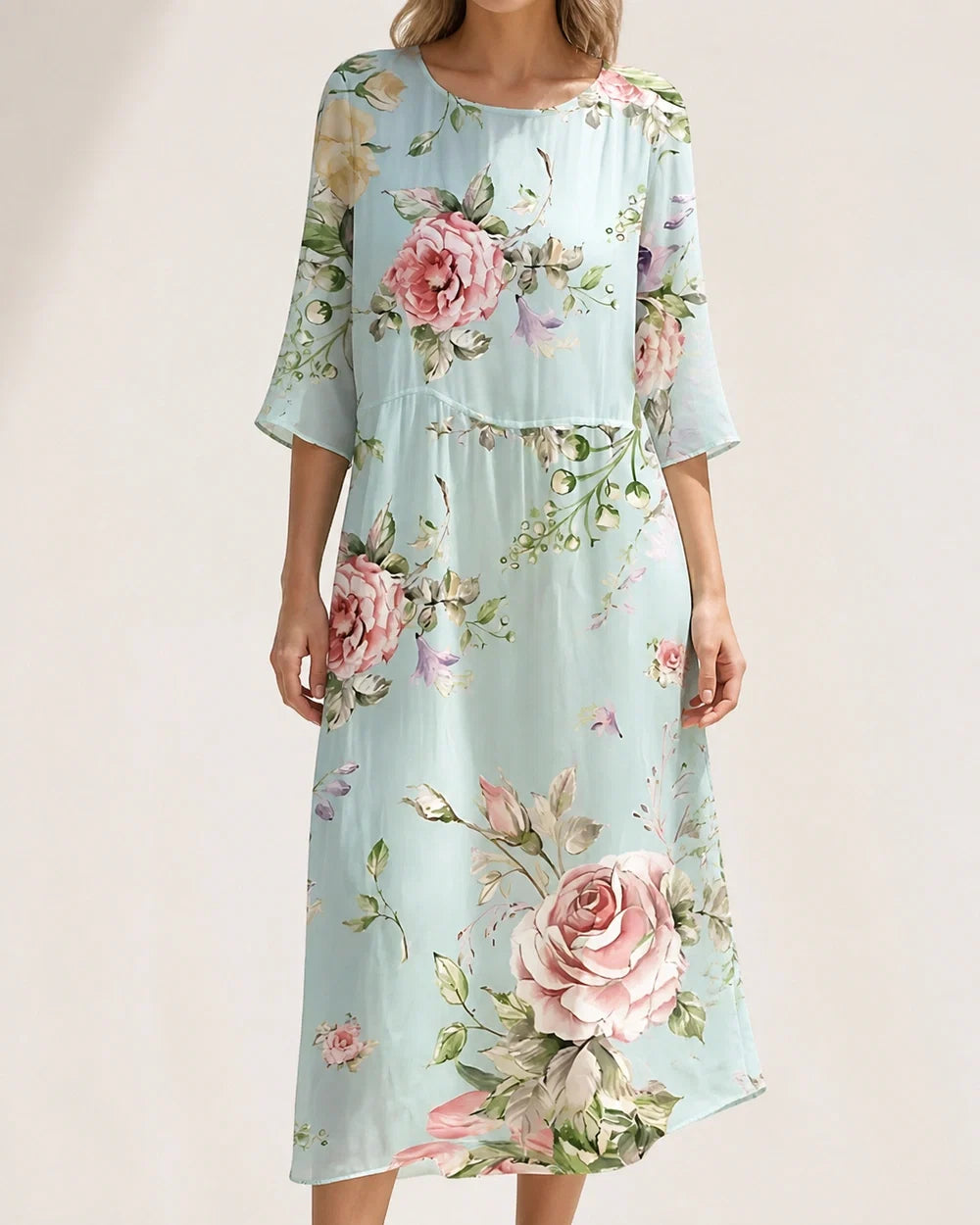 Women's loose floral midi dress in pale blue, front worn view