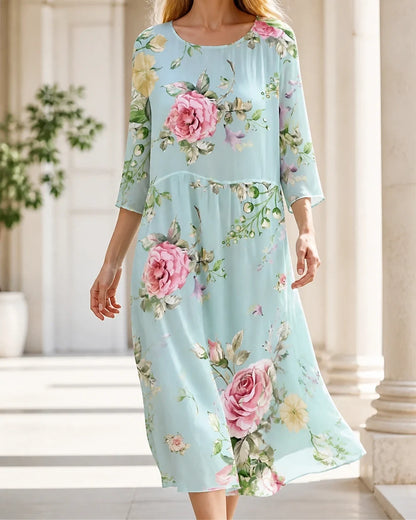 Women's pale blue floral midi dress, walking lifestyle view