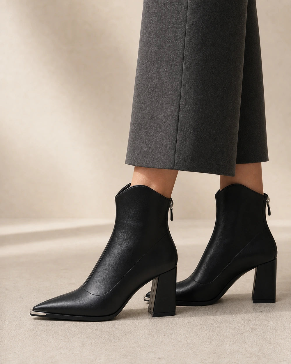 Chrome Toe Pointed Ankle Boots, black lateral profile. — merle-black-03-lateral-profile.webp
