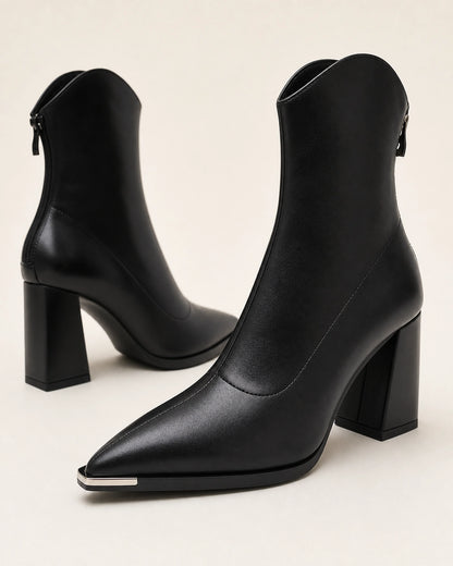 Chrome Toe Pointed Ankle Boots, black detail. — merle-black-05-material-detail.webp