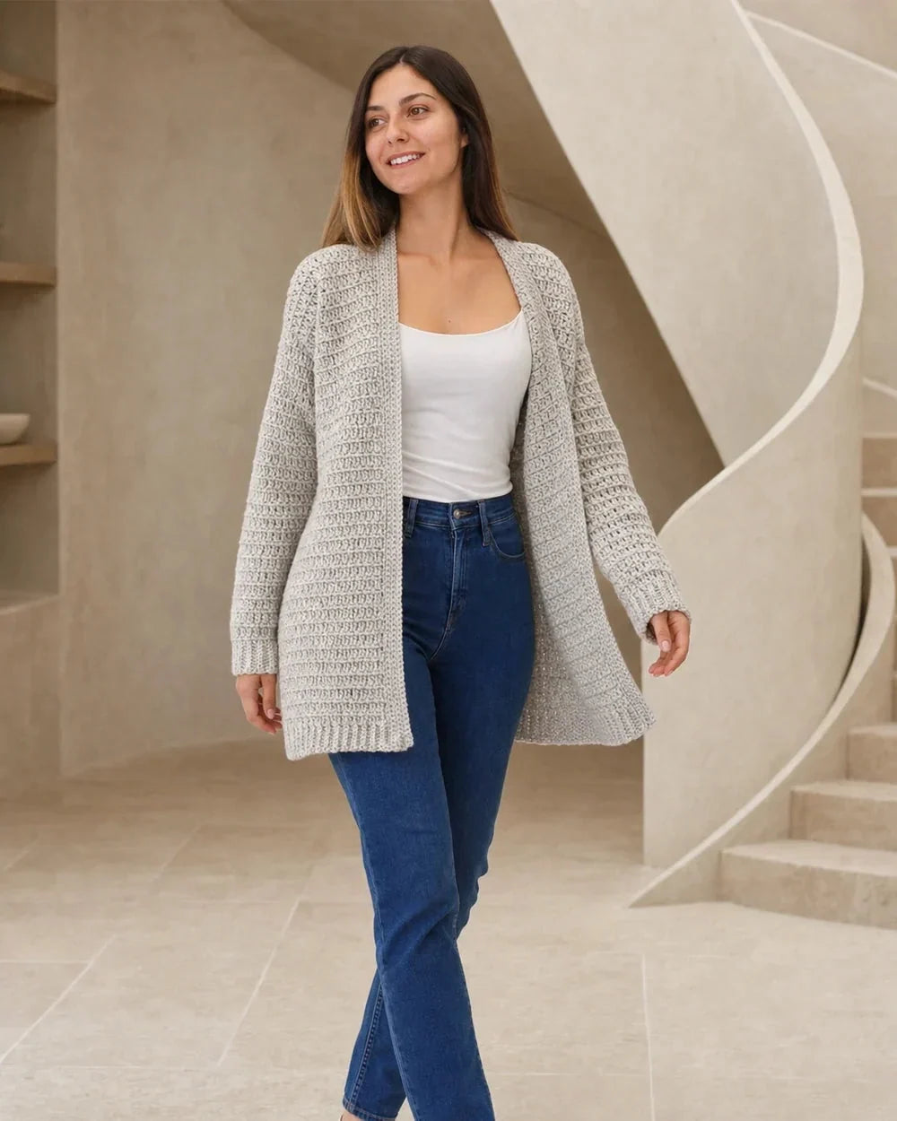 Grey lightweight crochet cardigan styled in a bright interior.