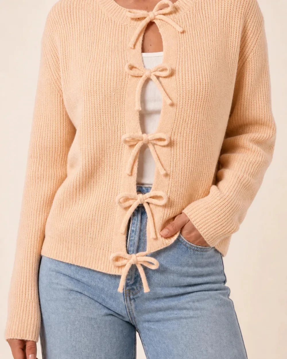 Apricot tie-front cropped cardigan for women, front hero view.