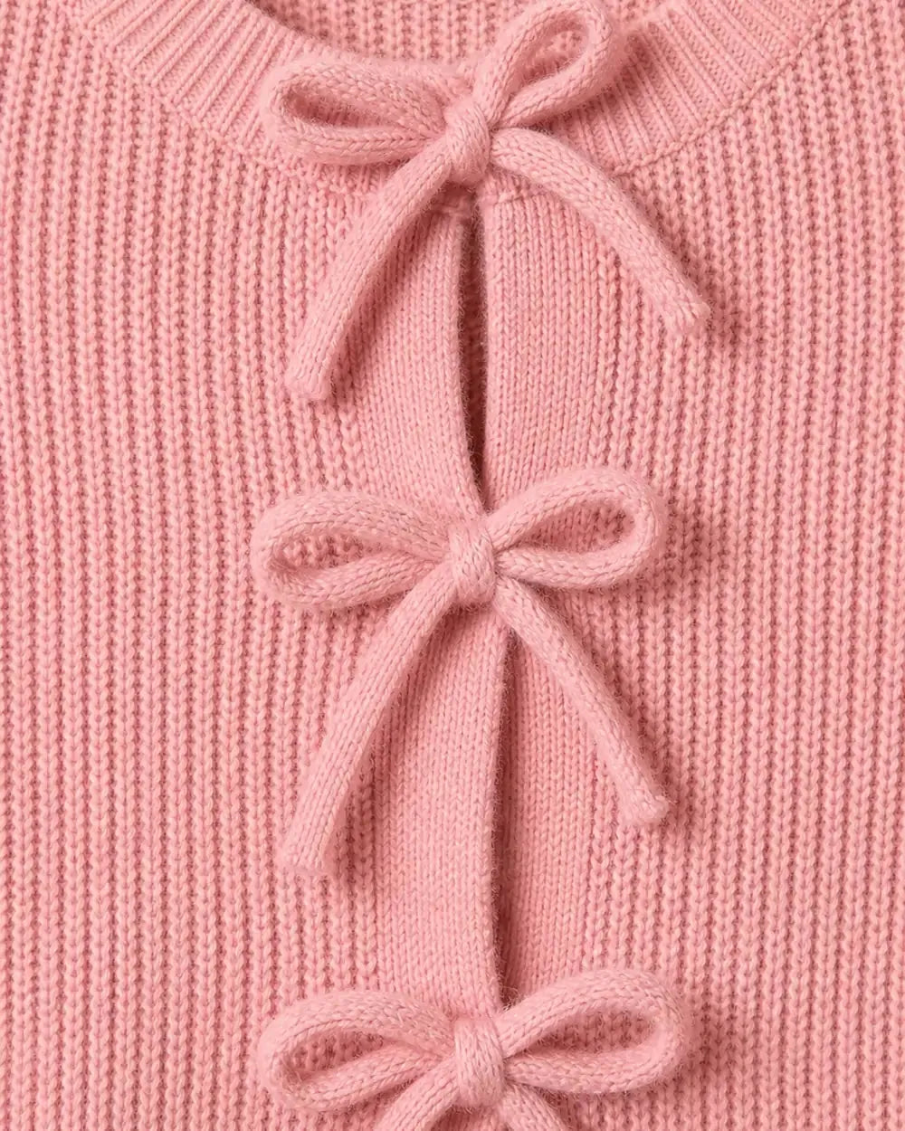 Close-up of the pink rib knit and tonal bow ties.