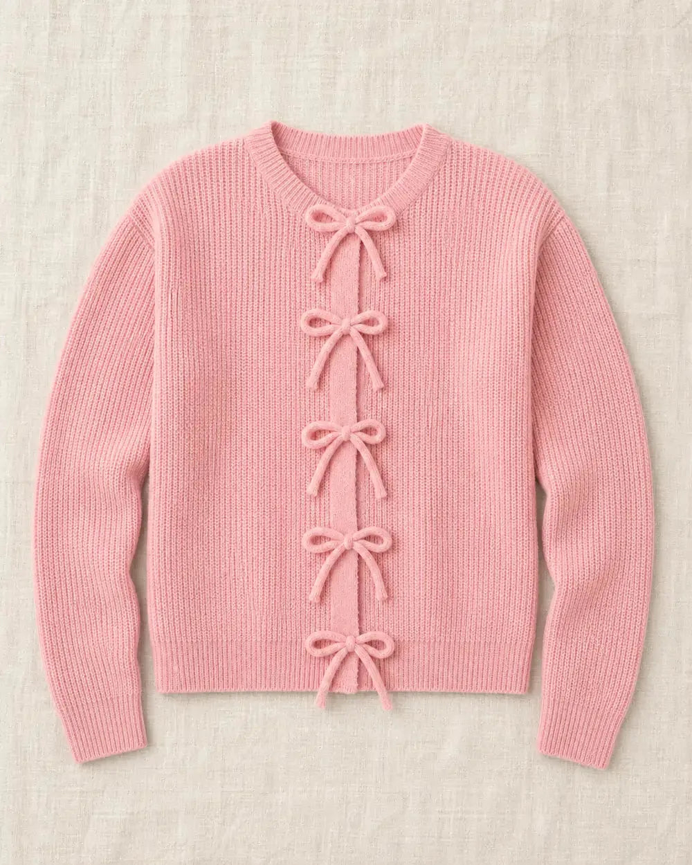 Pink ribbed tie-front cardigan, clean product-only flat lay.