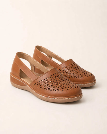 Pair of brown perforated slingback shoes.