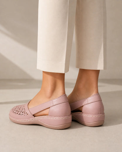 Women's light pink slingback shoes, rear view.
