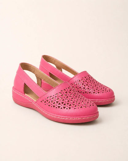 Pair of pink perforated slingback shoes.