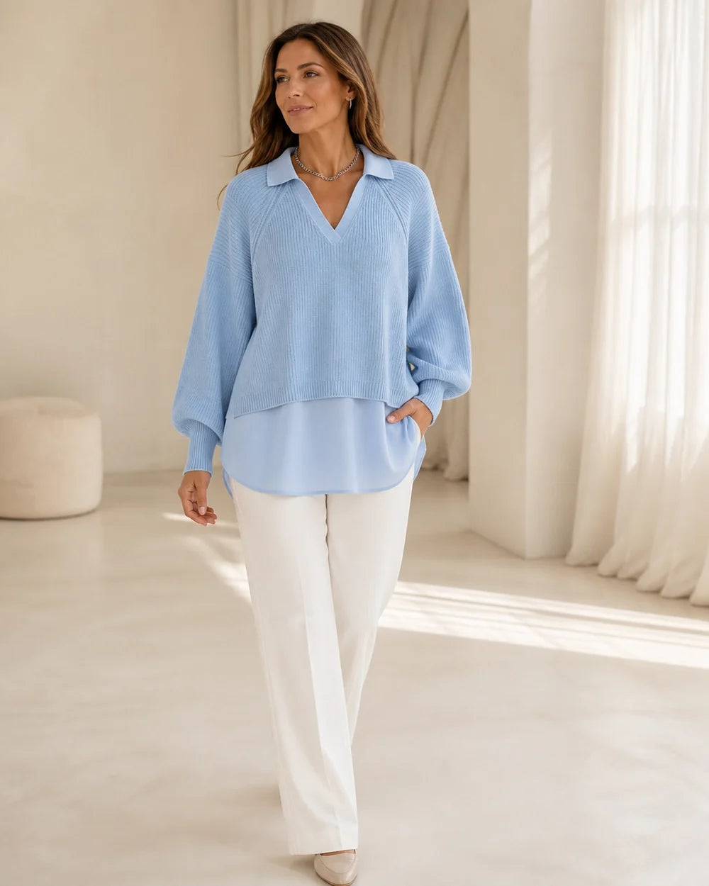 Women's powder-blue layered-look sweater, movement view