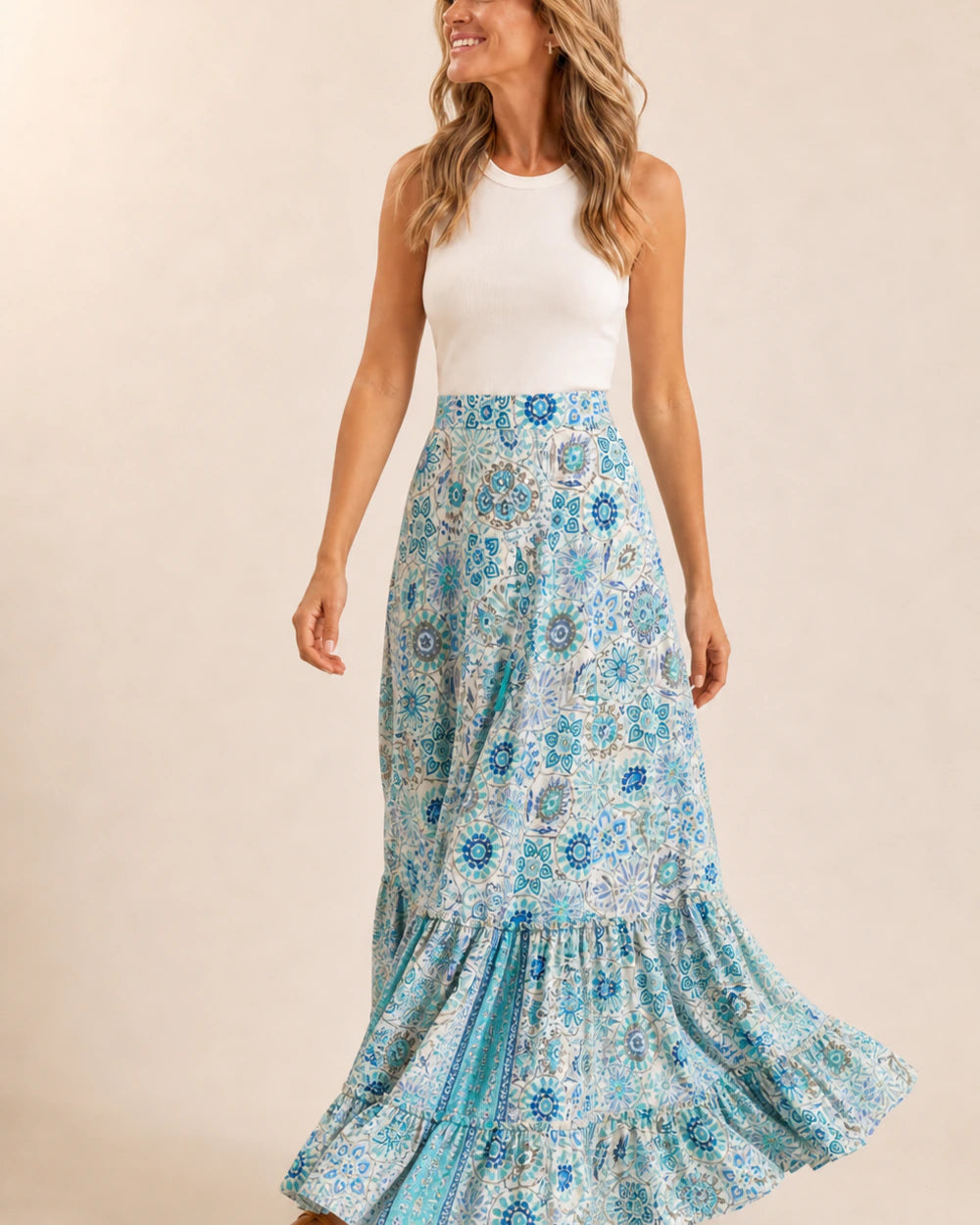 Women’s Blue Floral tiered maxi skirt shown in motion.
