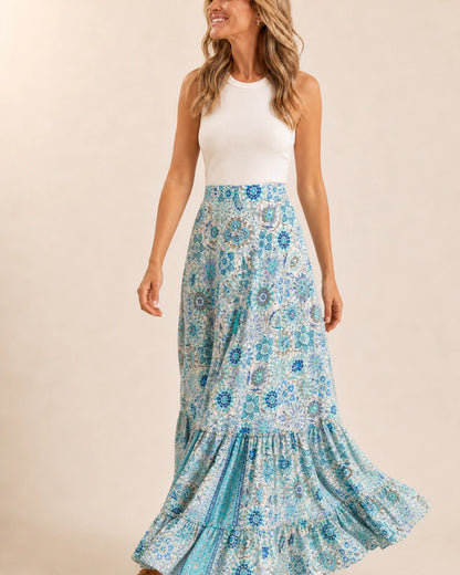 Women’s Blue Floral tiered maxi skirt shown in motion.