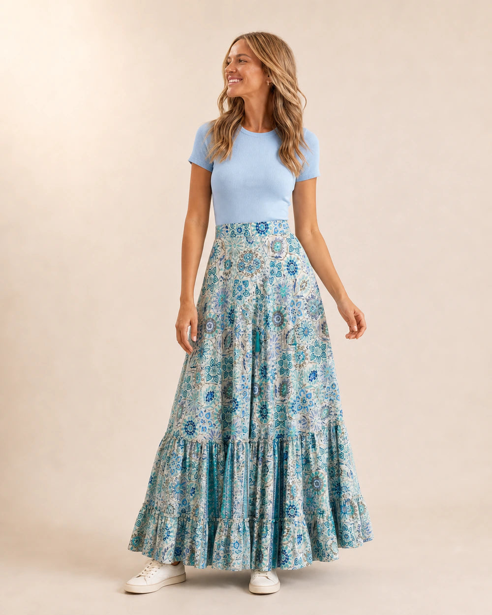 Women’s Blue Floral tiered maxi skirt styled with a blue top and sneakers.