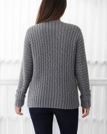 Grey openwork crochet cardigan, rear construction view.