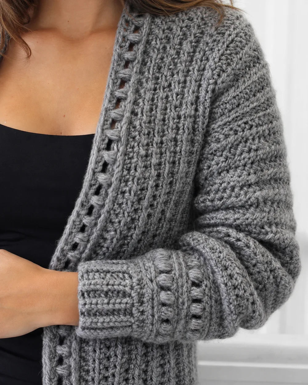 Close-up of the grey tonal bobble crochet texture and cuff.