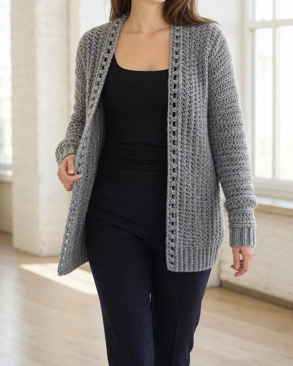 Grey crochet cardigan styled in a bright European interior.