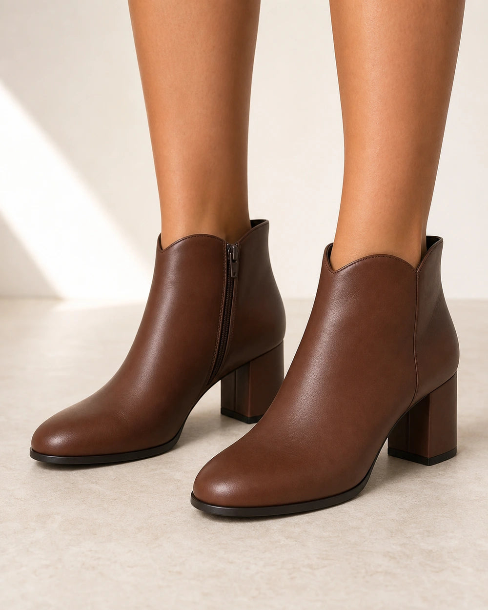 Women's brown American-style chunky-heel ankle boots, front three-quarter view.