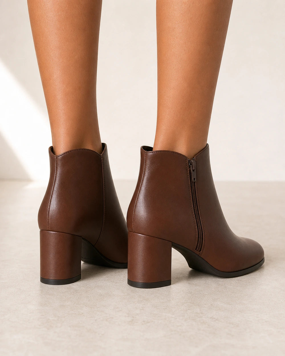 Women's American-style chunky-heel ankle boots, rear view.