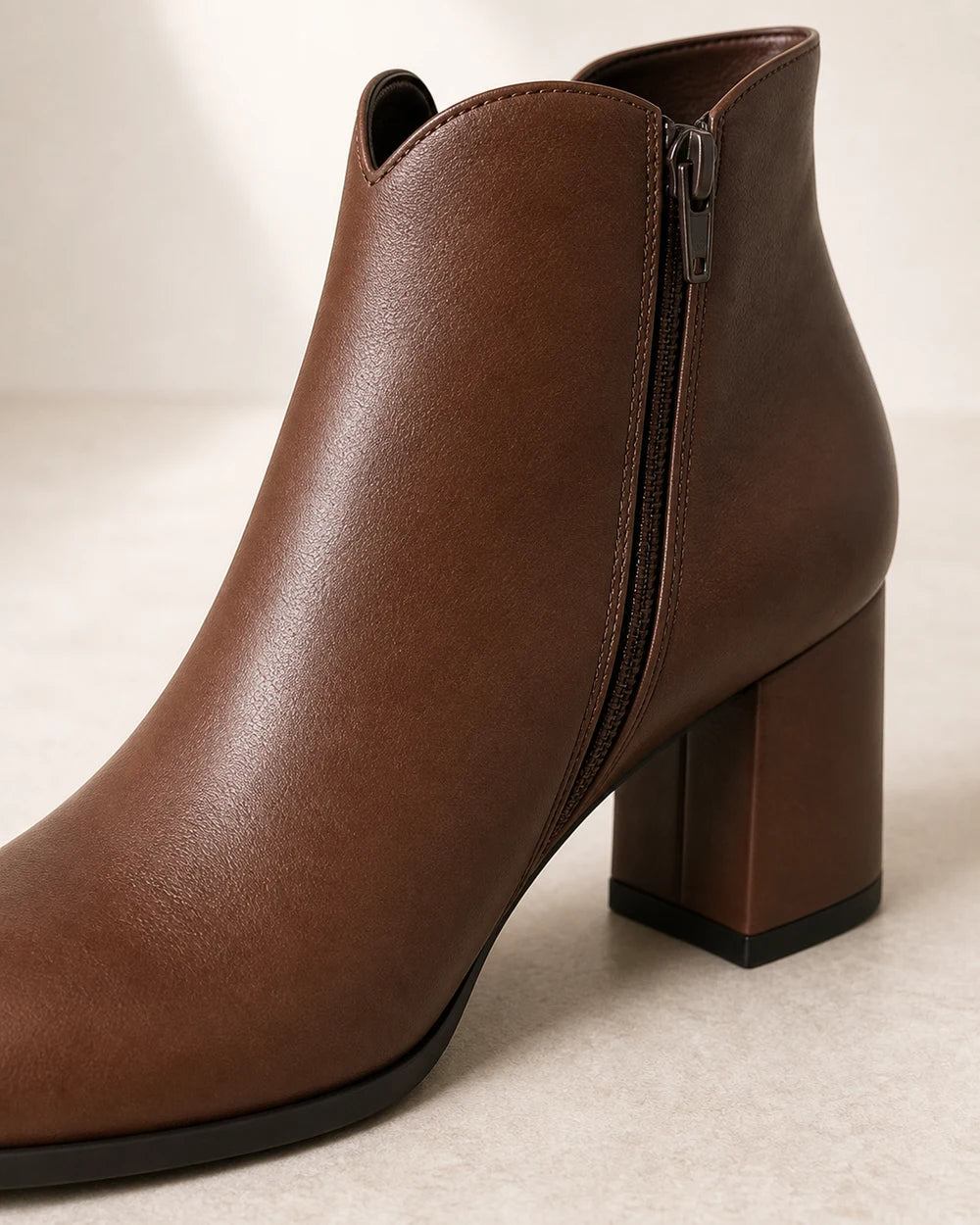 Women's American-style chunky-heel ankle boots, construction detail.