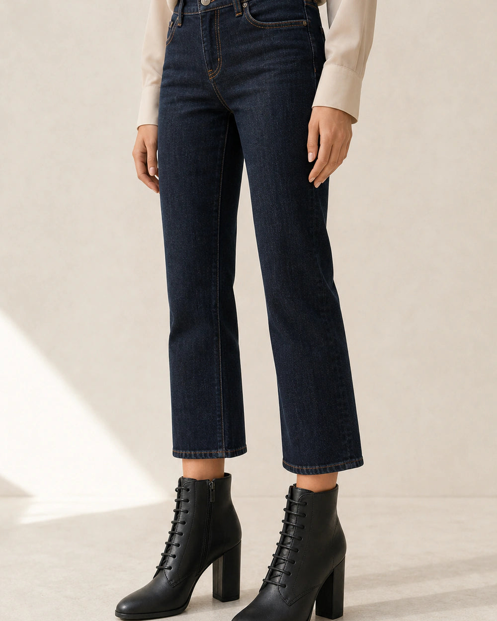 Women's black lace-up high-heel ankle boots, second styling view.