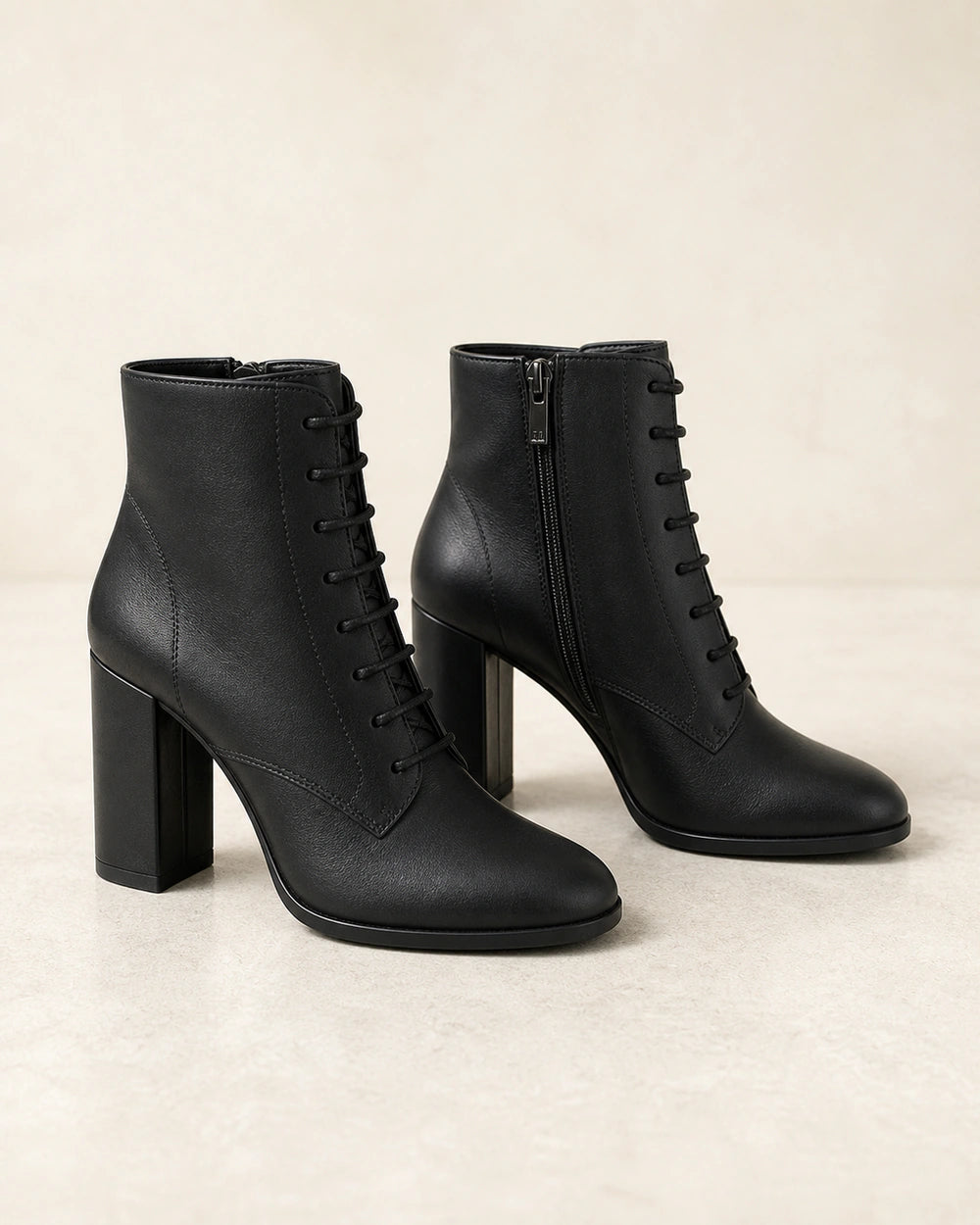 Women's black lace-up high-heel ankle boots, product-only view.