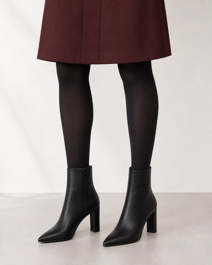Women's black pointed-toe high-heel ankle boots, second styling view.