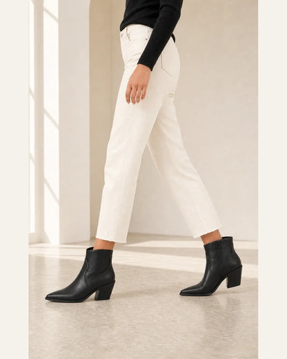 Black pointed western ankle boots, walking view without distortion.