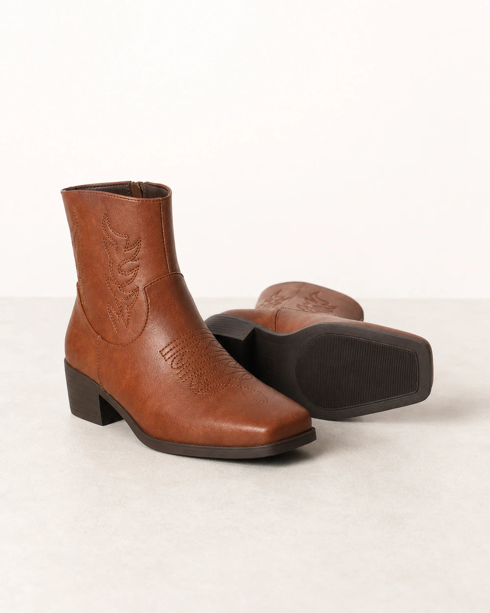 Women's brown square-toe western ankle boots, product-only view.