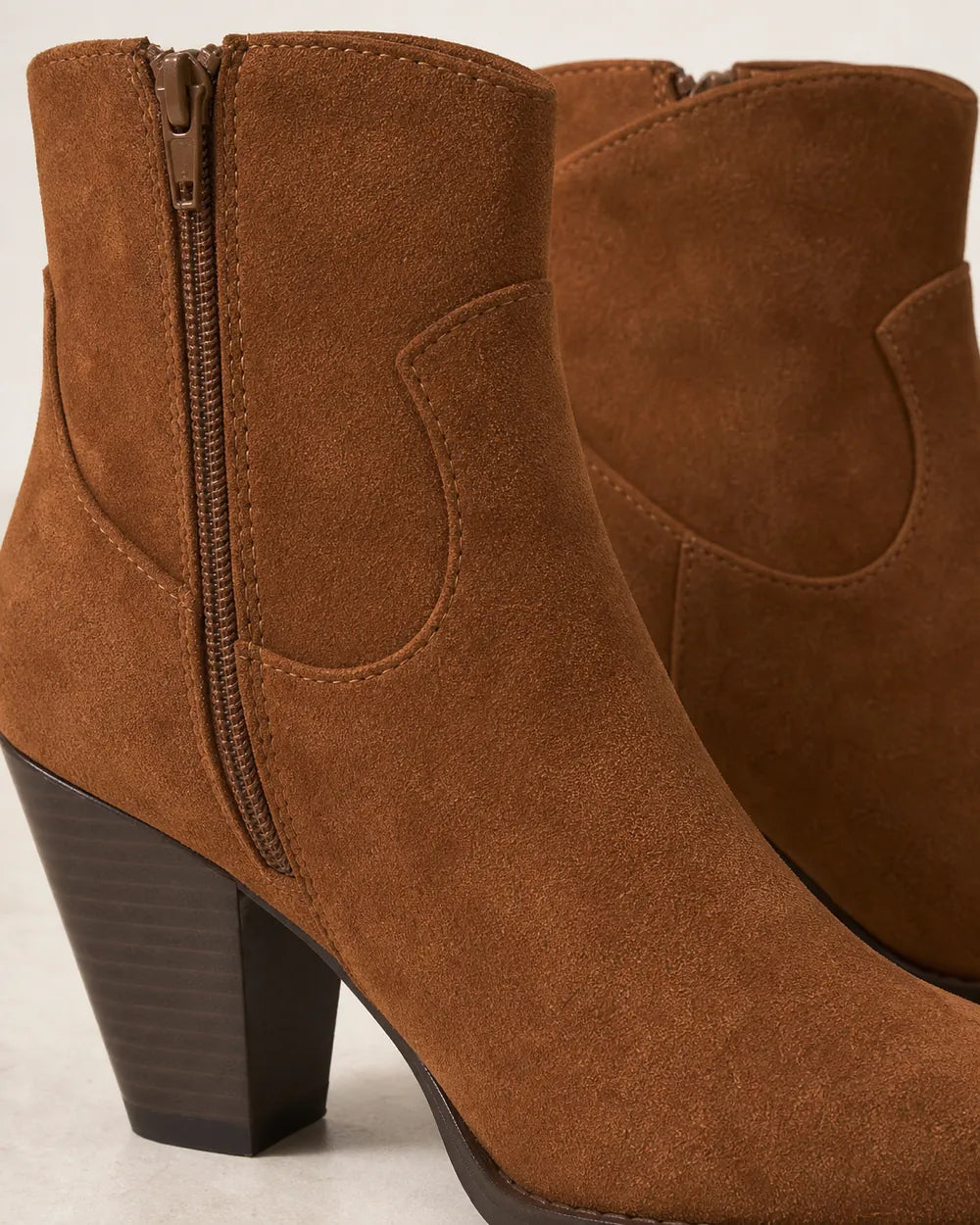 Women's brown suede-effect western ankle boots, construction detail.