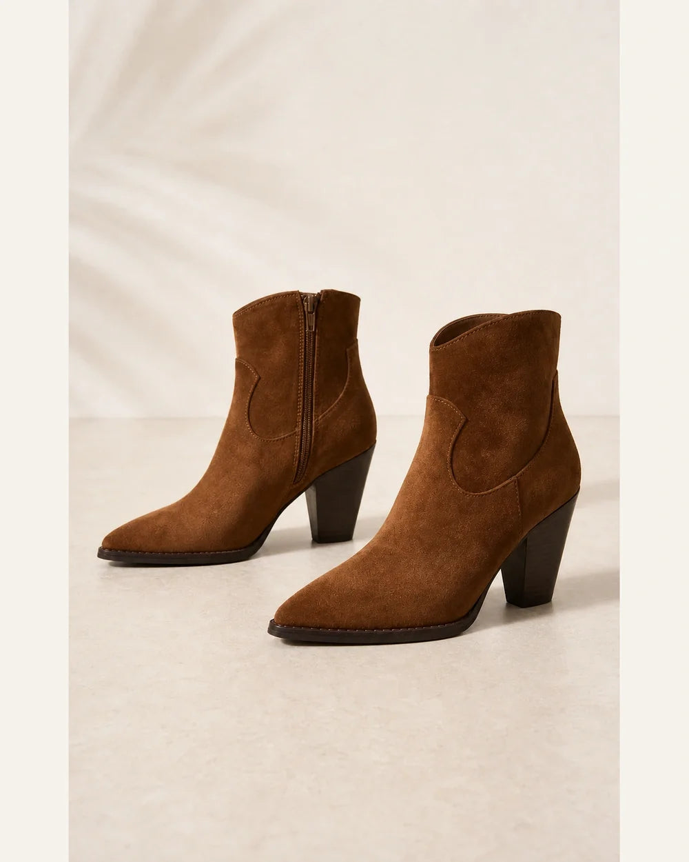 Brown suede western ankle boots, product-only view without distortion.