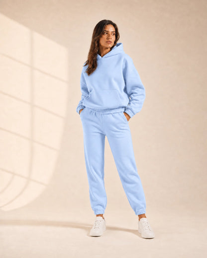 Women's light blue hooded two-piece jogger set, front view.