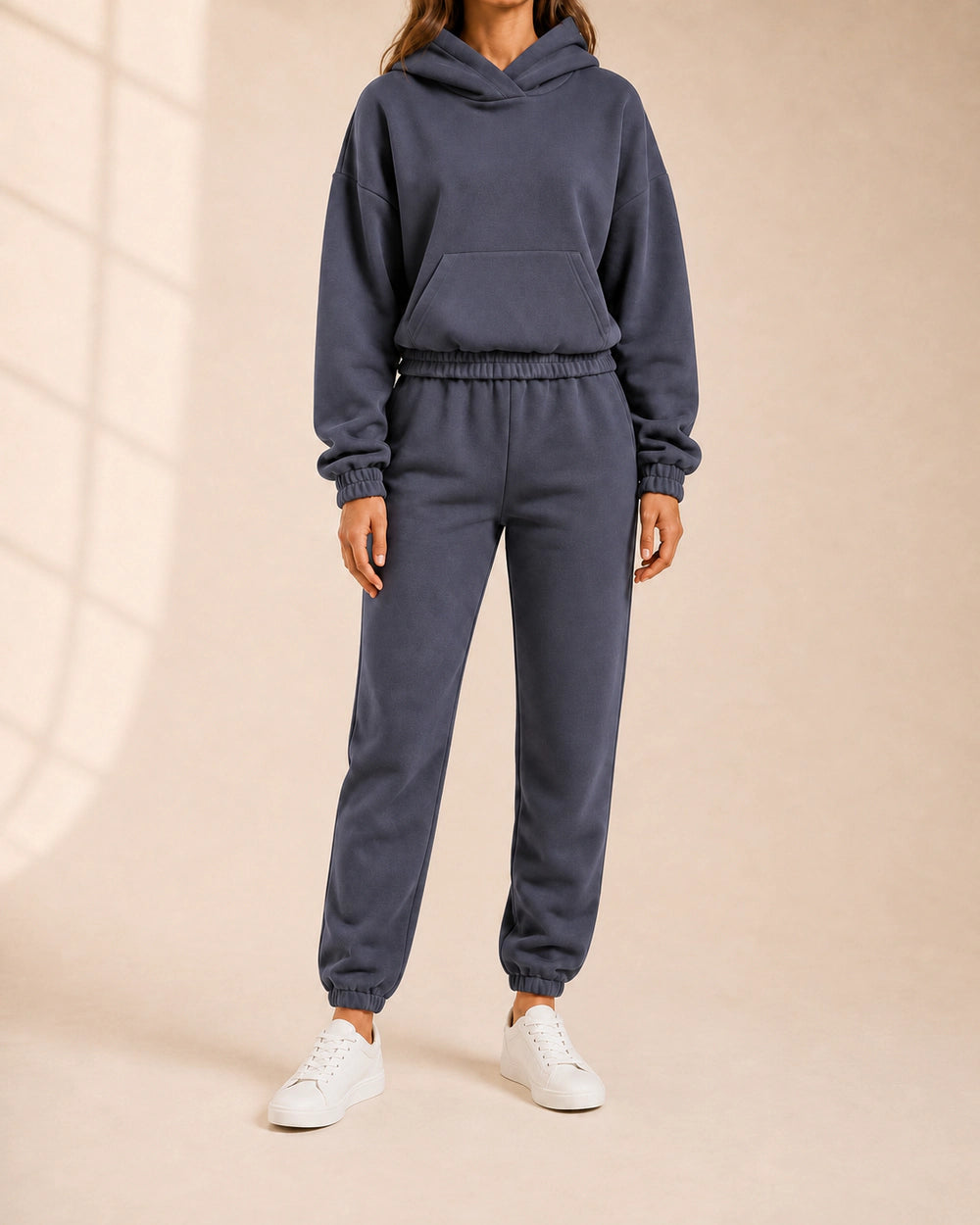 Women's grey hooded two-piece jogger set, front view.