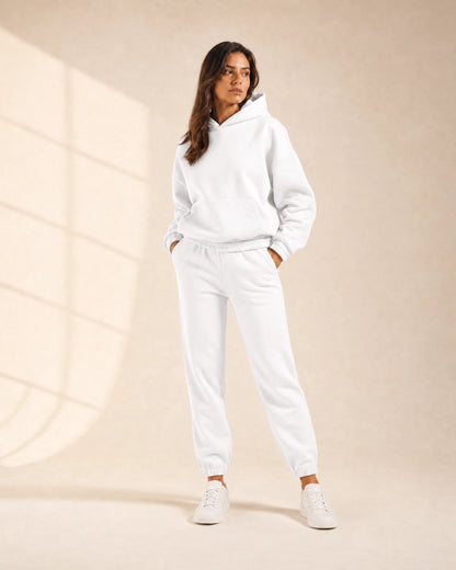 Women's white hooded two-piece jogger set, front view.