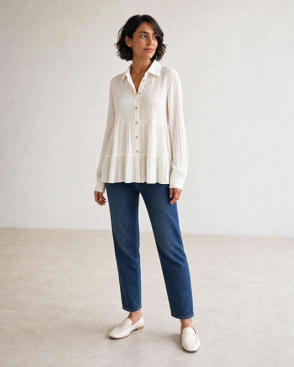 Women's milk-white pleated peplum shirt, complete silhouette.