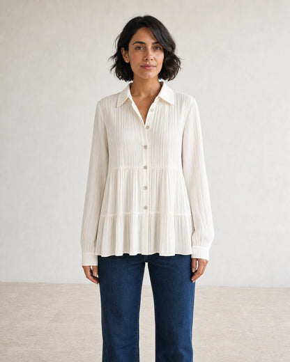 Women's milk-white pleated peplum shirt, straight front fit.