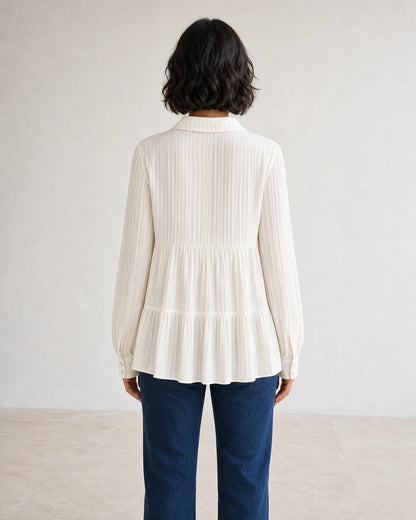 Women's milk-white pleated peplum shirt, rear fit view.
