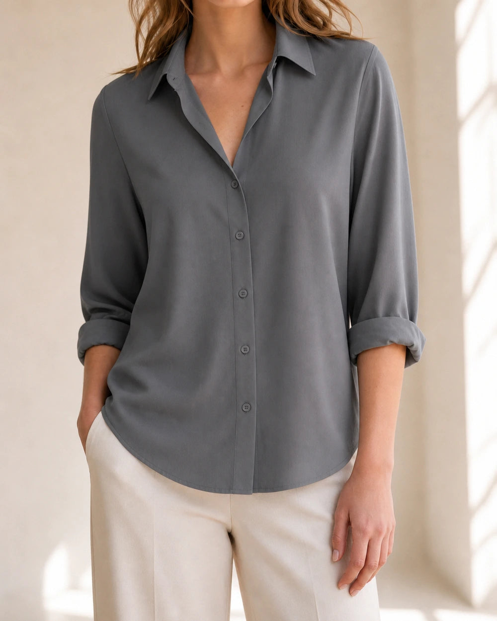 Women's grey relaxed button-front blouse, front product view.