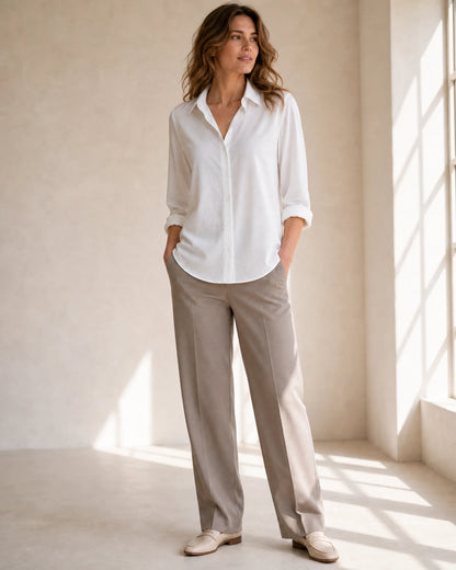 Women's white relaxed button-front blouse, complete styled silhouette.
